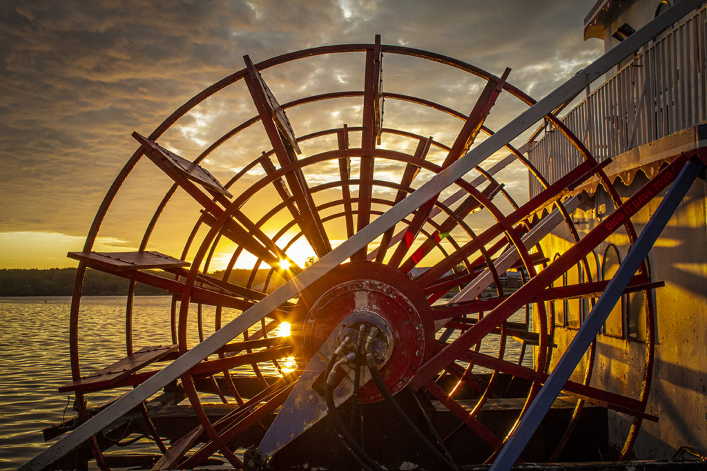 Sunrise seen through a paddle wheel