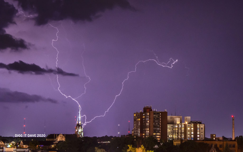 Lightning strikes near church steeple